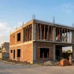 House construction stages in Lahore grey structure site in Bahria Orchard